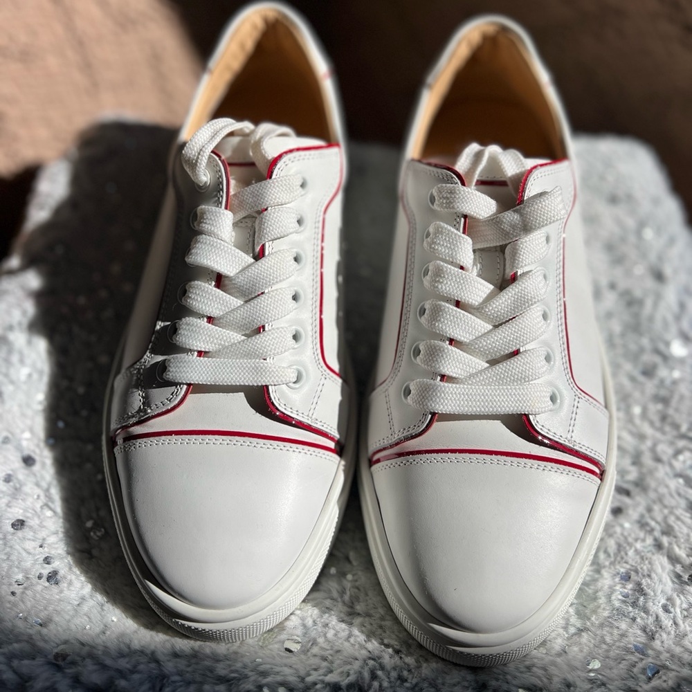 Brand New Louboutin sneakers. Size 39. White and red signature sole.